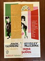 Irma La Douce 1963 poster showing colorful stylized characters and text with fold creases.