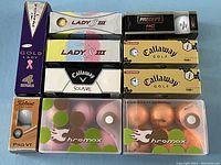 Photo showing full array of all 36 new golf balls in their original packaging.