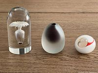 Photo showing all three glass pieces together on a wood surface to display size and scale.