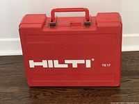 Closed red Hilti TE 17 carrying case with handle and latches visible