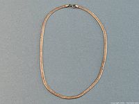 Full view of the vintage sterling silver choker necklace laid out flat showing the full length and design.