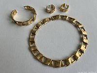 Image showing the full set: choker, bracelet, and earrings arranged on a white background.