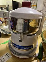 Photo of the Omega juicer front and top showing overall design and label.