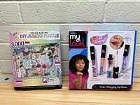 Photo of boxed Color & Bling DIY Jumbo Puzzle and My Look Color Changing Lip Gloss side by side on shelf