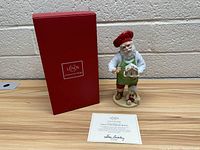 Photo of Lenox figure with original red Lenox box and certificate of authenticity showing dealer signature.