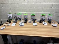 Seven boxed Charge Worx universal dash mounts lined up on a wooden surface showing packaging and mounts.