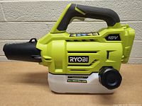 Ryobi P2805 One+ 18 Volt Cordless Chemical Fogger/Mister tool shown from handle and reservoir side, with visible power and fill line labels.
