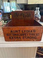 Front view showing painted advertising text on box front.