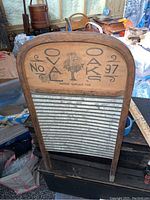 Full view of the rare bent wood and metal washboard, showing overall condition and design.