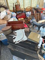 Photo of the lot showing tin bank shaped like house, black tin horse, metal box, cut tin animals, and old checker box