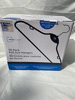 Front view of the 50-pack box of Mainstays felt suit hangers showing product name, image, and features.