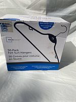 Box front showing Mainstays 50-pack felt suit hangers with cascade hooks.