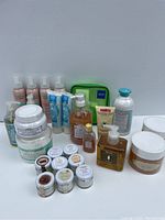 Full lot of assorted body and hand creams, various bottles, jars, and tubes from L'Oreal, Vichy, and Perlier brands.