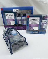 Front view of two Dr Teal's Epsom Salt gift sets in original packaging, showing bottles and Epsom Salt boxes.