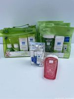 Full view of all Vichy skin products grouped with green transparent bags and individual items on white background