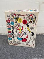 Front view of vintage Marx The Rock A Long Horses toy box showing colorful horse and rider illustrations and text.