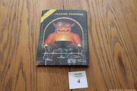 Front cover of the Advanced Dungeons & Dragons Players Handbook showing title and artwork.