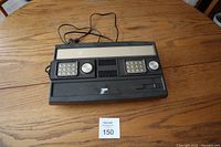 Mattel Intellivision console from top view without controllers showing numeric keypads and directional controls.