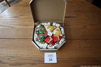 Photo of pizza sock set folded and arranged inside pizza box on wooden table.