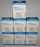 Seven boxed Dataproducts replacement ink cartridges arranged in a pyramid stack showing front and top sides of boxes.