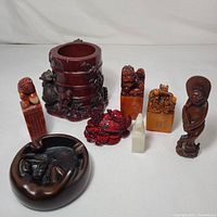 Wide view of all Feng Shui inspired vintage figurines and decor items arranged on white background.