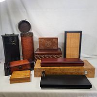 Photo showing 10 assorted wood boxes of various shapes and styles on a white backdrop
