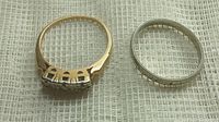 Both rings side by side on fabric background