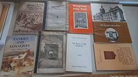 View of all nine soft cover booklets showing various Kingston historical topics and cover art.