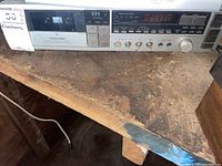 Realistic SCR-3010 stereo cassette receiver showing front view and control panel on a wooden surface.