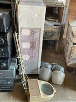Magnifying light with articulating arm, two outdoor light fixtures and boxed vanity light in a garage setting