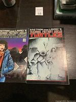 Two Teenage Mutant Ninja Turtles comic books placed side by side showing front covers.
