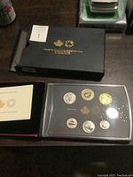 Closed black box for the Royal Canadian Mint 2017 Specimen Set with visible gold lettering and small booklet included.
