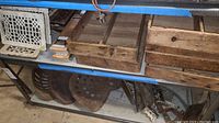 Wooden boxes on shelf with compartments visible and aged wood finish
