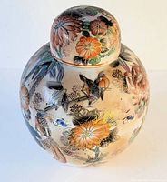 Front view of large vintage Chinese ginger pot with lid showing hand-painted floral and bird motifs.