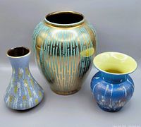 Three Carstens West German pottery vases grouped showing various glaze patterns and their comparative sizes