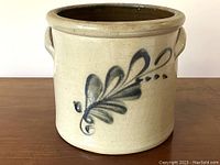 Front view showing cobalt blue leaf motif and overall shape