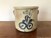 Front view of crock showing overall shape and floral motif