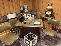 Full lot: card table, chairs, barrel lamp, mugs, yeast box, coasters, bottle crate