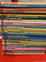 Stack of 29 vintage children's books from the 1970s Walt Disney Productions Wonderful World of Reading series, showing book titles and colorful spines.