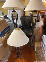 Group shot of two floor lamps and one table lamp with shades