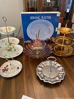 Overview of all tiered serving trays and the new serving platter in box