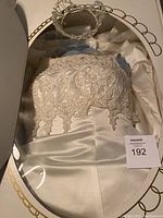 Wedding dress with lace and beadwork detail and satin fabric inside box