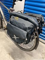 Pair of Arkel panniers mounted on rear bike rack, showing overall setup