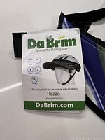 Tag showing brand, model Rezzo, and product benefits including UPF 50+ and rain shade