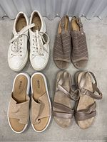 Top view of four pairs of women's shoes: white sneakers, taupe perforated sandals, beige slip-on sandals, mauve strappy sandals.