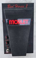 Top angled view of Morley Bad Horsie 2 pedal showing black ribbed pedal and red 'Morley' logo with 'Bad Horsie 2' label.