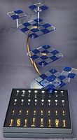 Full set showing board assembly with curved support and foam tray with 32 metal chess pieces
