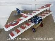 Full view of SPAD XIII model airplane with patriotic 'Stars & Stripes' paint scheme.