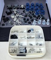 Set of painted and unpainted Warhammer 40,000 miniatures including Space Marine Terminators and others plus storage case with compartments.