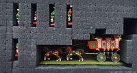 Miniatures and Imperial War Wagon model stored in protective foam with slots for pieces